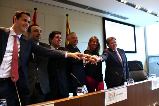 Senior Barcelona trade delegates celebrate the series of events
